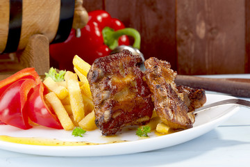 Grilled ribs on plate