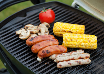 Grill bbq sausages and vegetables