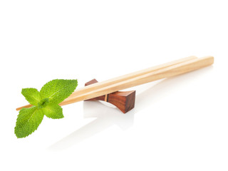 Sushi chopsticks with mint leaves
