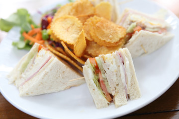Club sandwich with on wood background