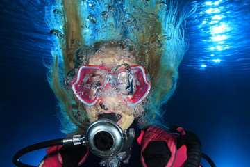 Portrait of female scuba diver underwater