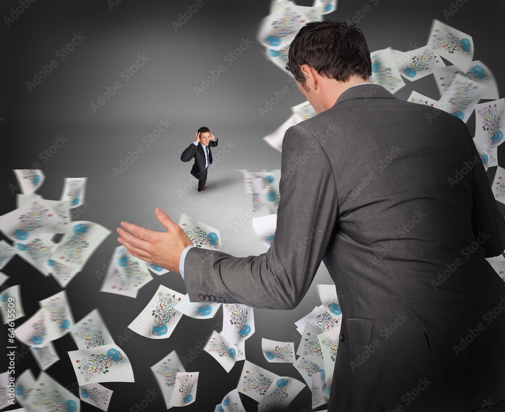 Poster Composite image of businessman posing with hands out with tiny b
