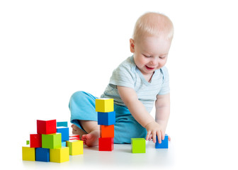 kid boy playing  wooden block toys © Oksana Kuzmina