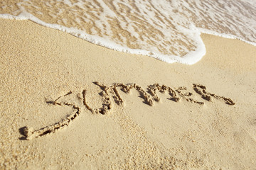 Handwritten summer on sand