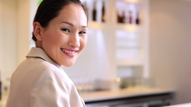 Asian businesswoman smiling at camera