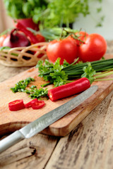 Fresh vegetables cutting on kitchen board
