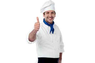 Young chef showing double thumbs up