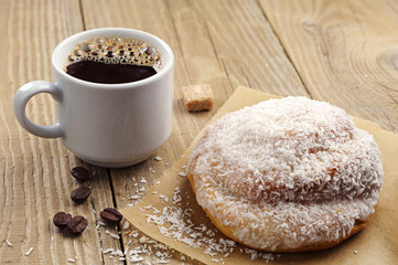 Sweet bun and cup of coffee