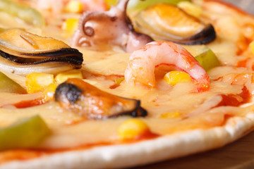 texture pizza with sea fruit closeup. horizontal.