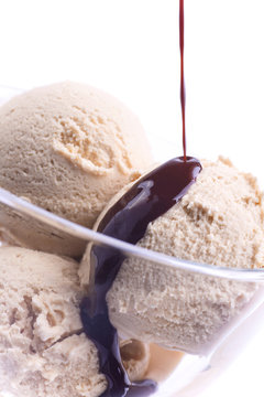 Vanilla creme brulee chocolate ice cream balls in glass bowl