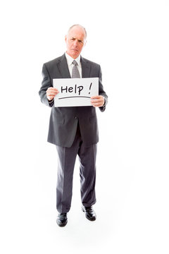 Businessman holding a message board with the text words "Help"
