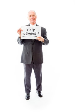 Businessman holding a message board with the text words "Help wa