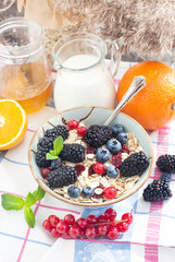 Healthy breakfast with granola and fresh berries
