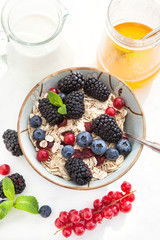 Healthy breakfast with granola and fresh berries