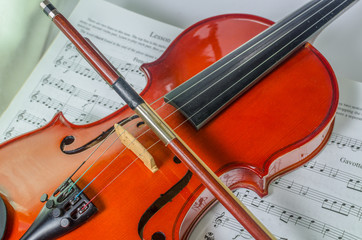 Fototapeta na wymiar Closeup photo of violin and bow