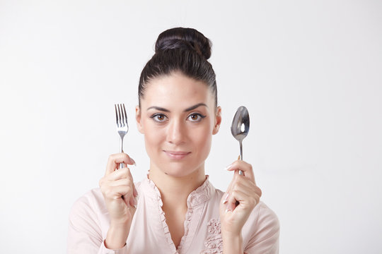 woman with spoon and fork