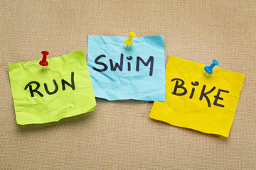 run, bike, swim - triathlon concept