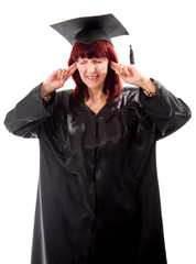 Mature student standing with fingers in her ears