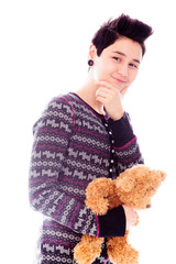 Portrait of a young woman holding teddy bear