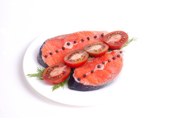 Salmon with tomato on white isolated background