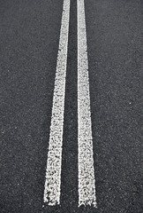 Asphalt road with white double solid line. Transportation backgr