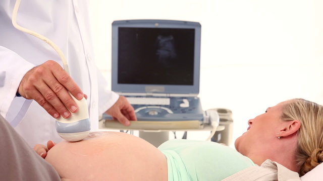 Pregnant woman having a sonagram scan