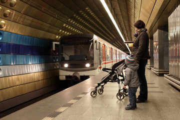 Fototapeta premium Mother with son at subway station