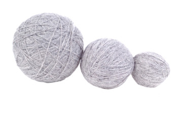 three grey yarn balls isolated