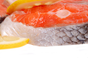 Salmon with lemons on white