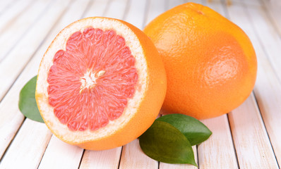 Fototapeta na wymiar Ripe grapefruit on table close-up