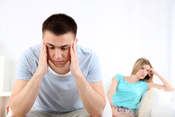 Portrait of young man and woman  conflict sitting