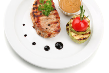 Grilled steak and grilled vegetables on plate, isolated on