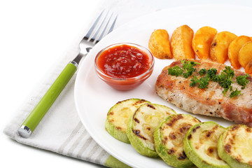 Grilled steak and grilled vegetables on plate, isolated on