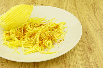 Mango slice with cayenne pepper