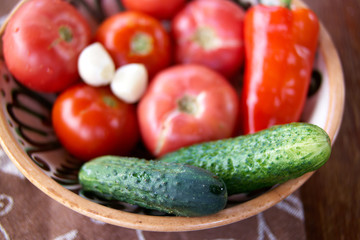 Tomato,cucumber and paprika on the old plate