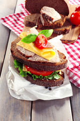 Delicious sandwiches with meet on table close-up