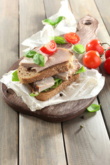 Delicious sandwiches with meet on table close-up