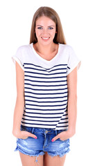 Fototapeta premium Beautiful young girl in shorts and t-shirt isolated on white