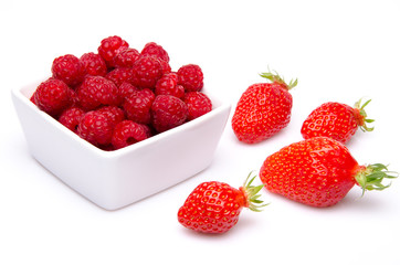 A cup of raspberries with strawberries