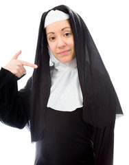 Young nun pointing herself