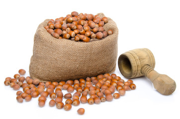 Hazelnuts in a burlap bag with a nutcracker