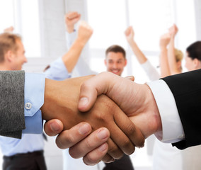 businessman and businesswoman shaking hands