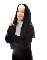 Young nun thinking and pointing up