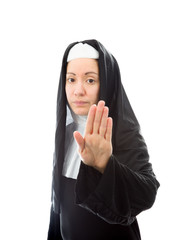 Young nun making stop gesture sign from both hands