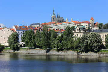 Fototapeta na wymiar View on the spring Prague gothic Castle above River Vltava
