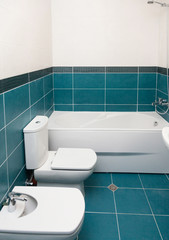 Vertical Shot of light bathtub in a bathroom.