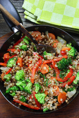 Buckwheat with carrots, onions, broccoli and paprika