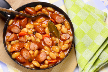 Beans with tomato sauce and sausage