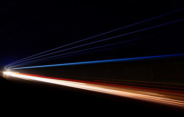 Car light trails in the tunnel.