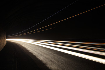 Car light trails in the tunnel.